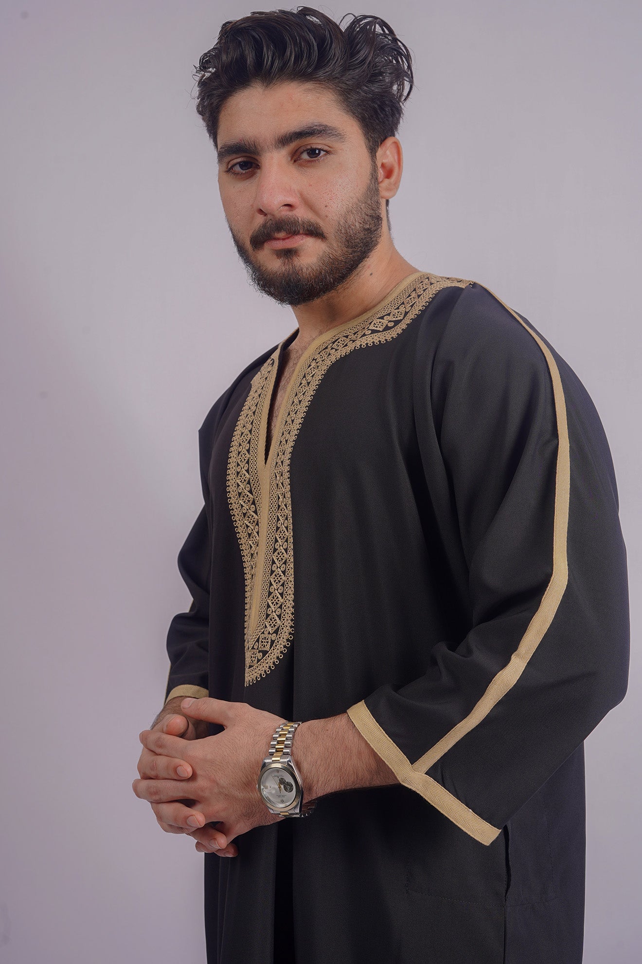 Luxurious Black Djellaba by Aamsah, adorned with golden embroidery, competes with MyBatua, ideal for significant Islamic events and formal wear