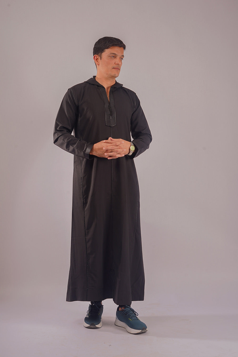 Elegant Hooded Black Thobe modeled, competing with offerings from Al Aniq and MuslimLifestyleStore.com, perfect for contemporary Muslim wear.