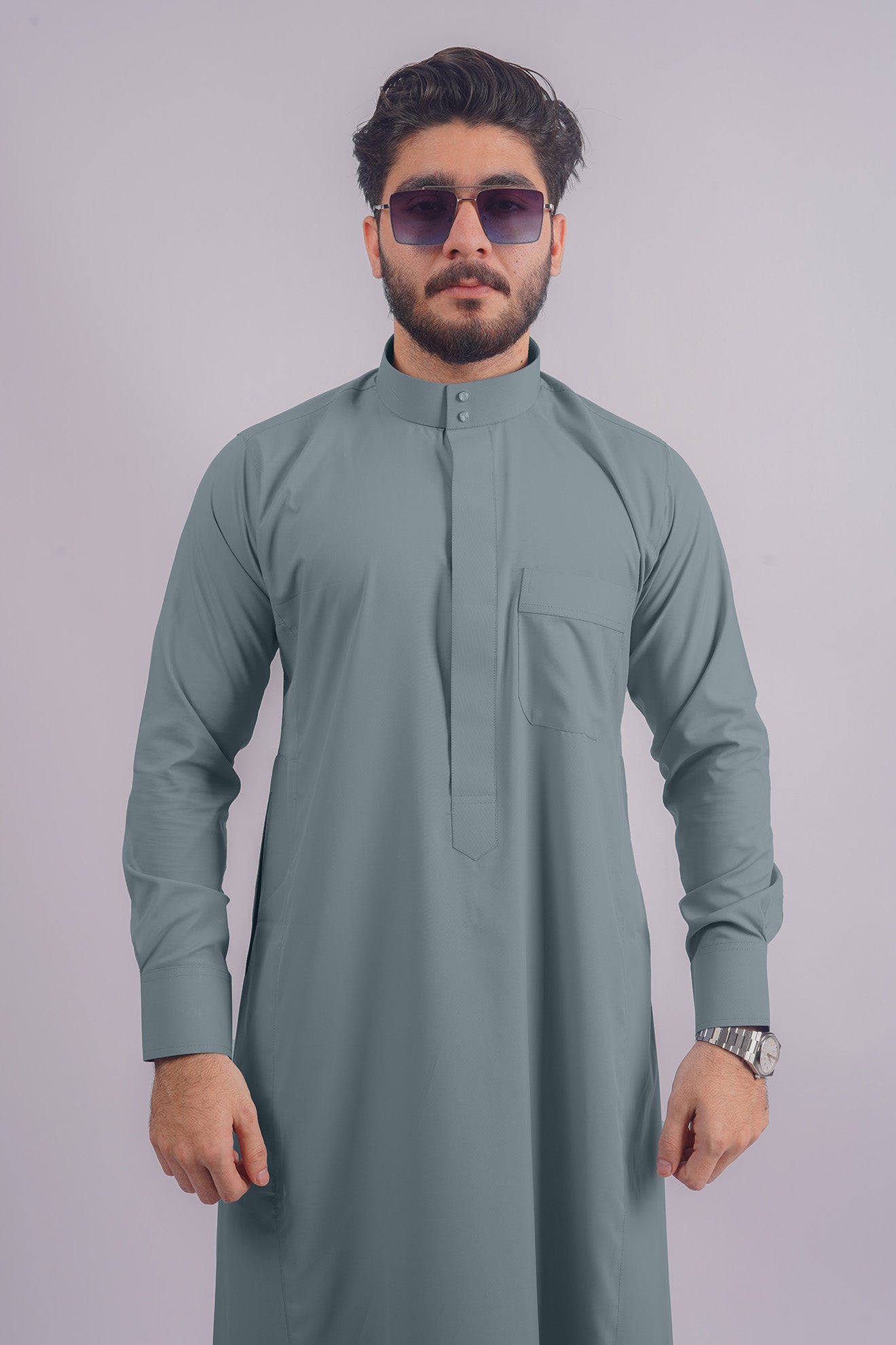 Aamsah's Dusty Blue Saudi Thobe, an elegant alternative to MuslimAmerican.com’s offerings, perfect for formal and casual wear.