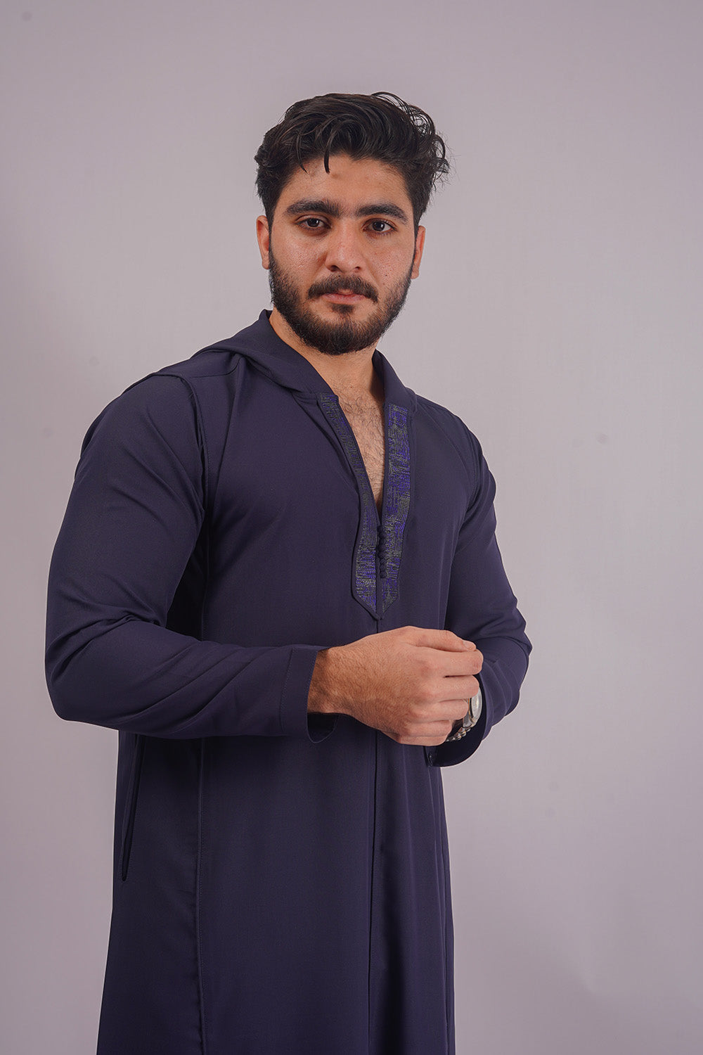Shop Aamsah’s Navy Blue Hooded Thobe, crafted for distinction and style, rivalling the sophisticated pieces from Abaya Buth.