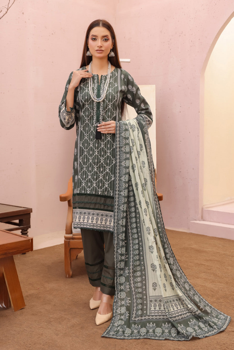 Pakistani lawn suit with white embroidery and pleated pants.