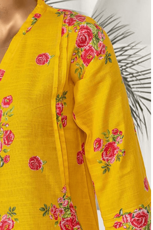 Aamsah’s women’s winter co-ords set in yellow Khaddar fabric, featuring a floral printed kurta and matching pants.