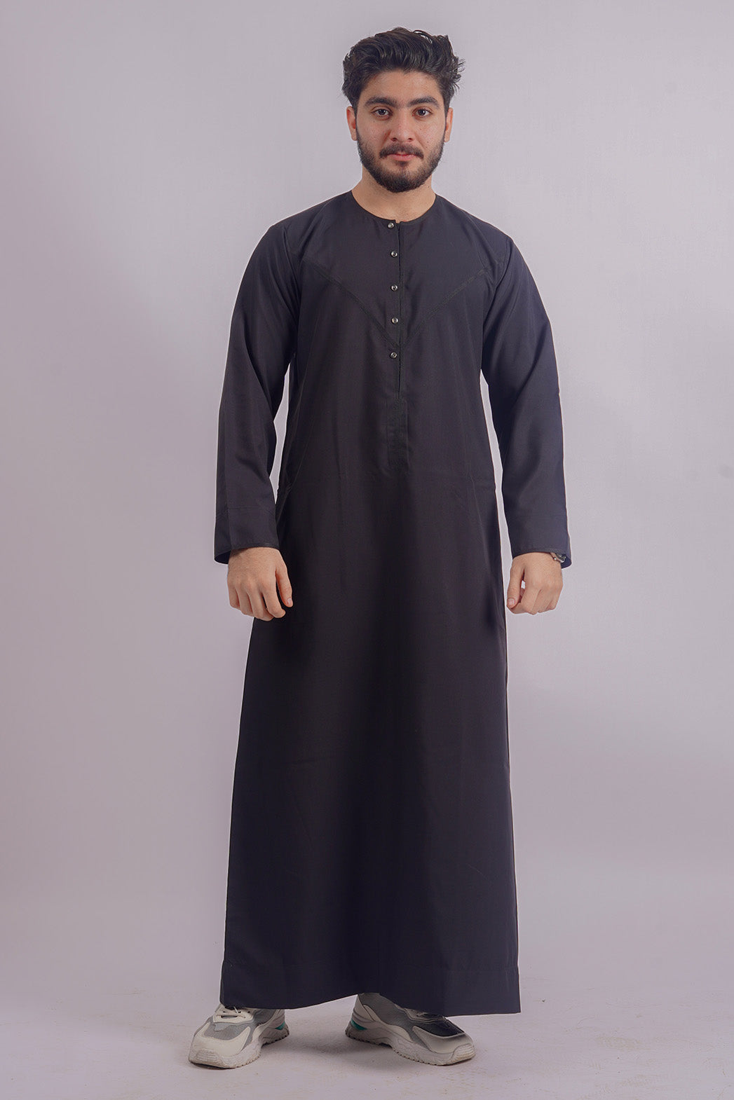Shop Aamsah’s Traditional Black Kandura, rivaling the luxurious feel of MuslimAmerican.com, perfect for formal and spiritual gatherings.