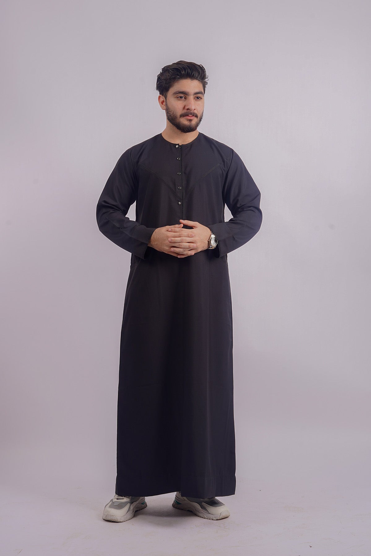 Experience the sleek style of Aamsah’s Black Thobe, comparable to Shukr Clothing, designed with imported fabric for comfort and elegance.