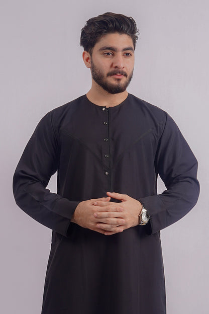 Classic Black Dishdasha by Aamsah, offering an elegant alternative to Alqamees, crafted for sophistication with high-quality stitched detail.