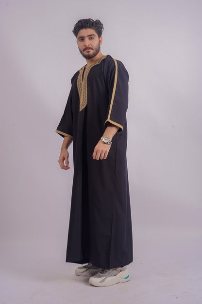 Aamsah's Black Thobe with Golden Detailing offers a majestic look comparable to MuslimAmerican.com, suited for religious celebrations and daily elegance.