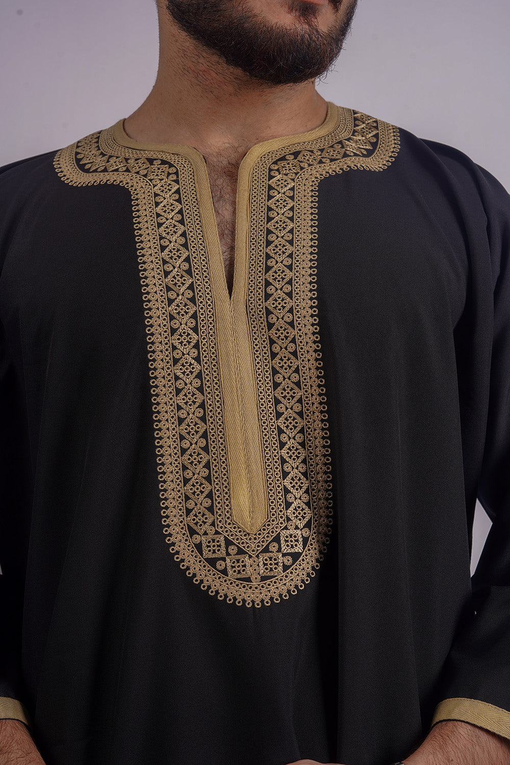 Shop Aamsah's premium Black Thobe with intricate golden stitching, a sophisticated choice akin to Alqamees styles for weddings and festivities.