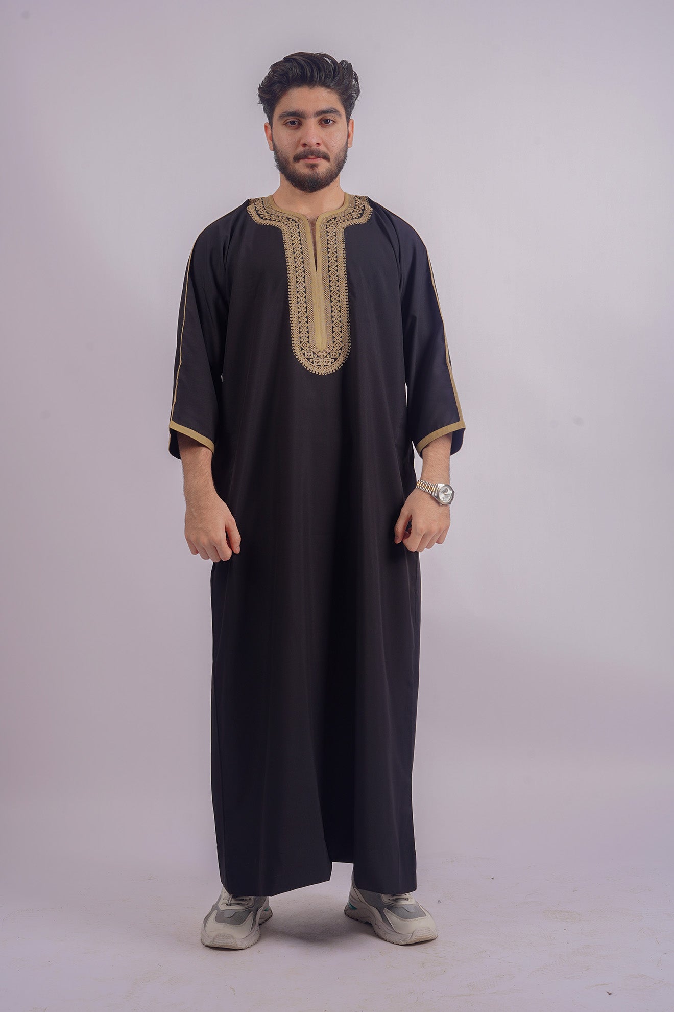 Elegant Black Djellaba from Aamsah, featuring luxurious golden embroidery, rivals premium offerings from Shukr Clothing for spiritual gatherings