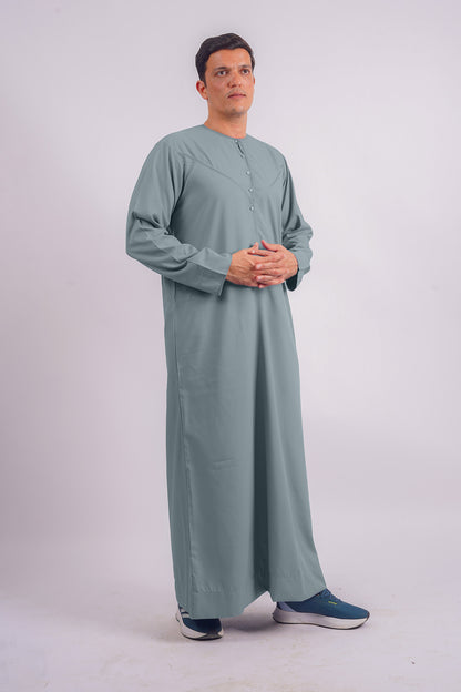 Elegant and sophisticated, AamsahÕs Dusty Blue Emirati Thobe rivals Abaya ButhÕs collection for its modern take on classic wear