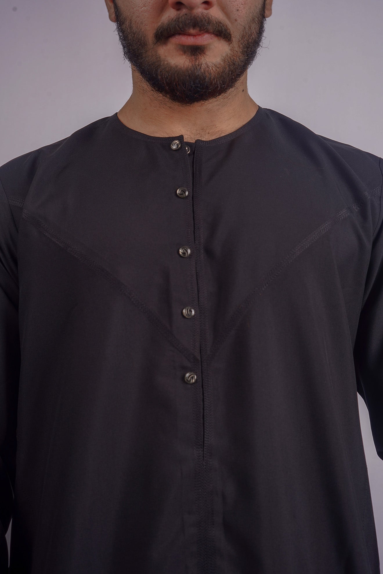 Aamsah's Premium Black Qamis, blending tradition with modern design, competing with offerings from Al Aniq for a sophisticated wardrobe addition.