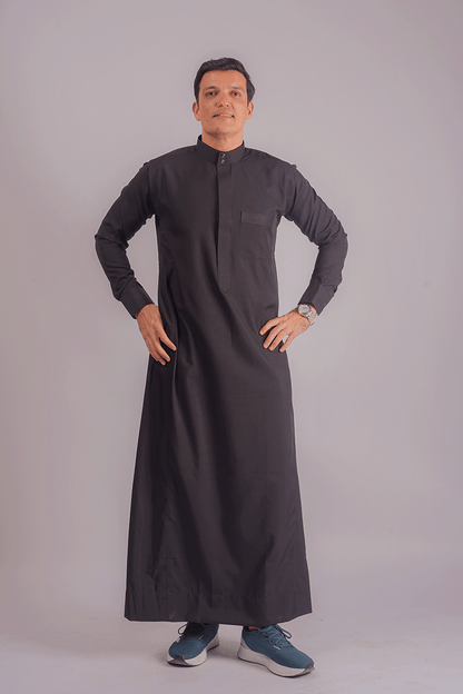Elegant black Kuwaiti thobe with front pocket, tailored for men, showcasing premium fabric and refined craftsmanship. Competitors include Shukr and Sunnah Style.