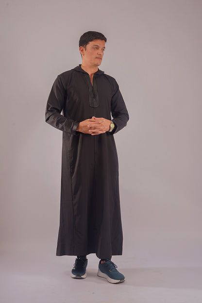 Elegant Hooded Black Thobe modeled, competing with offerings from Al Aniq and MuslimLifestyleStore.com, perfect for contemporary Muslim wear.
