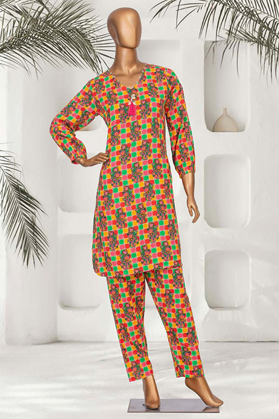 Colorful Pakistani women's kurta set with green, orange, and magenta patterns for stylish wear