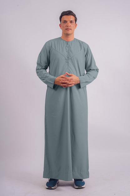 Aamsah's Emirati Dusty Blue Thobe, a refined alternative to The Muslimah Collection's traditional offerings, perfect for modern elegance