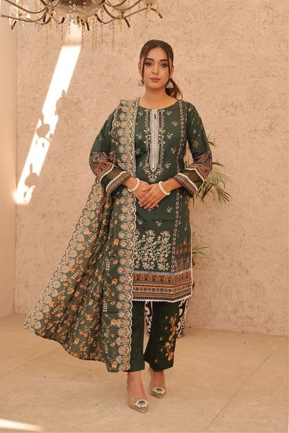 Elegant emerald green Pakistani dress featuring floral embroidery, with dupatta and pants, styled by designers like Al Karam and Maria B.