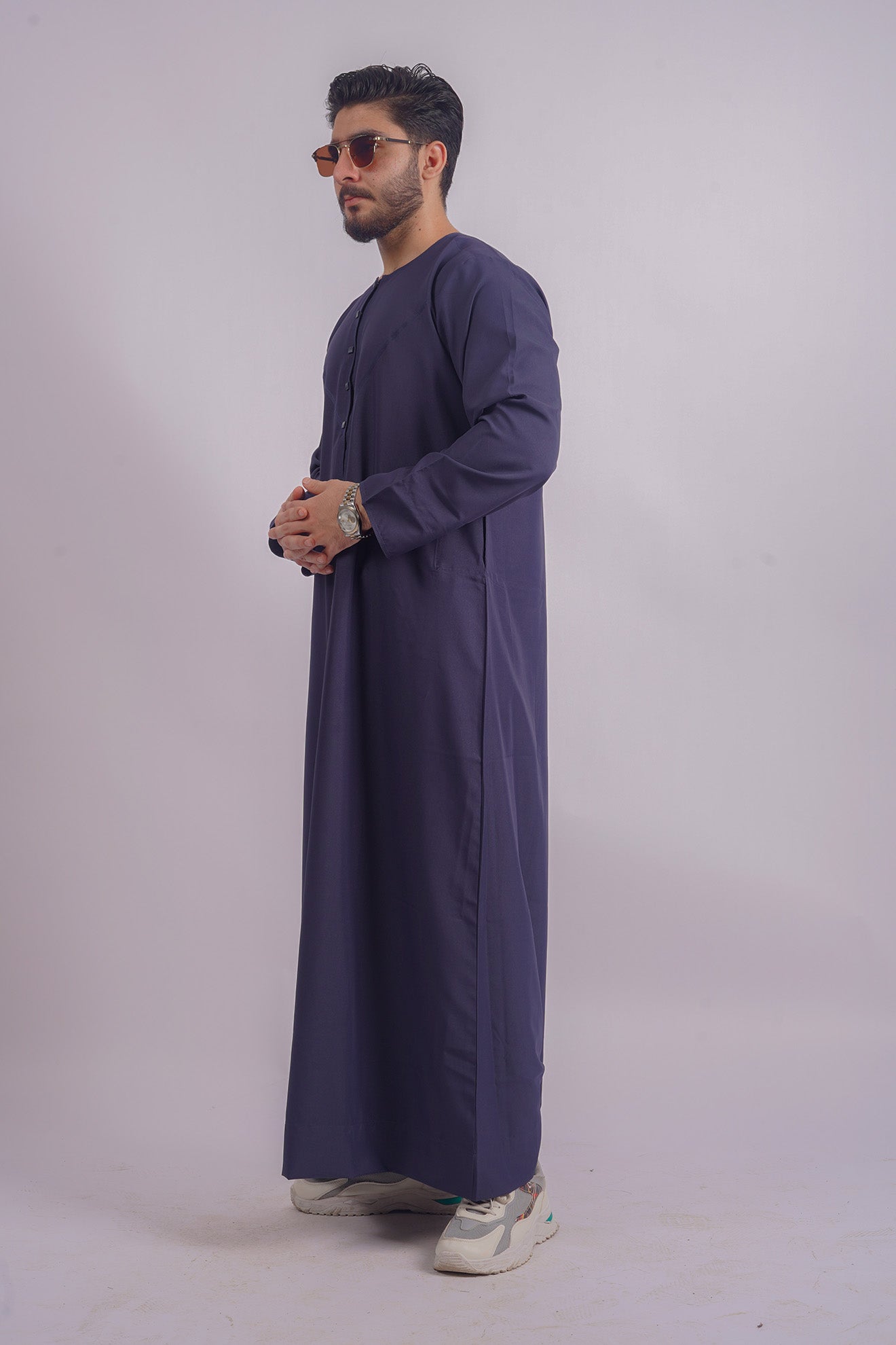 Shop Aamsah's Navy Blue Thobe, echoing the finesse of Shukr Clothing, designed for durability and timeless elegance.