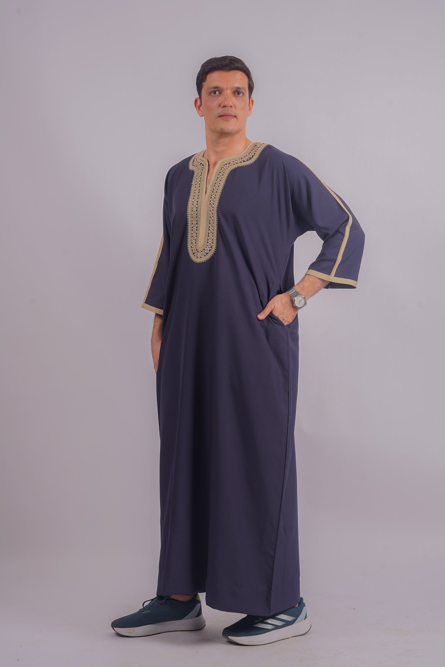 Discover the sophistication of Aamsah's Navy Blue Thobe with intricate golden detailing, a stylish alternative for festive attire.