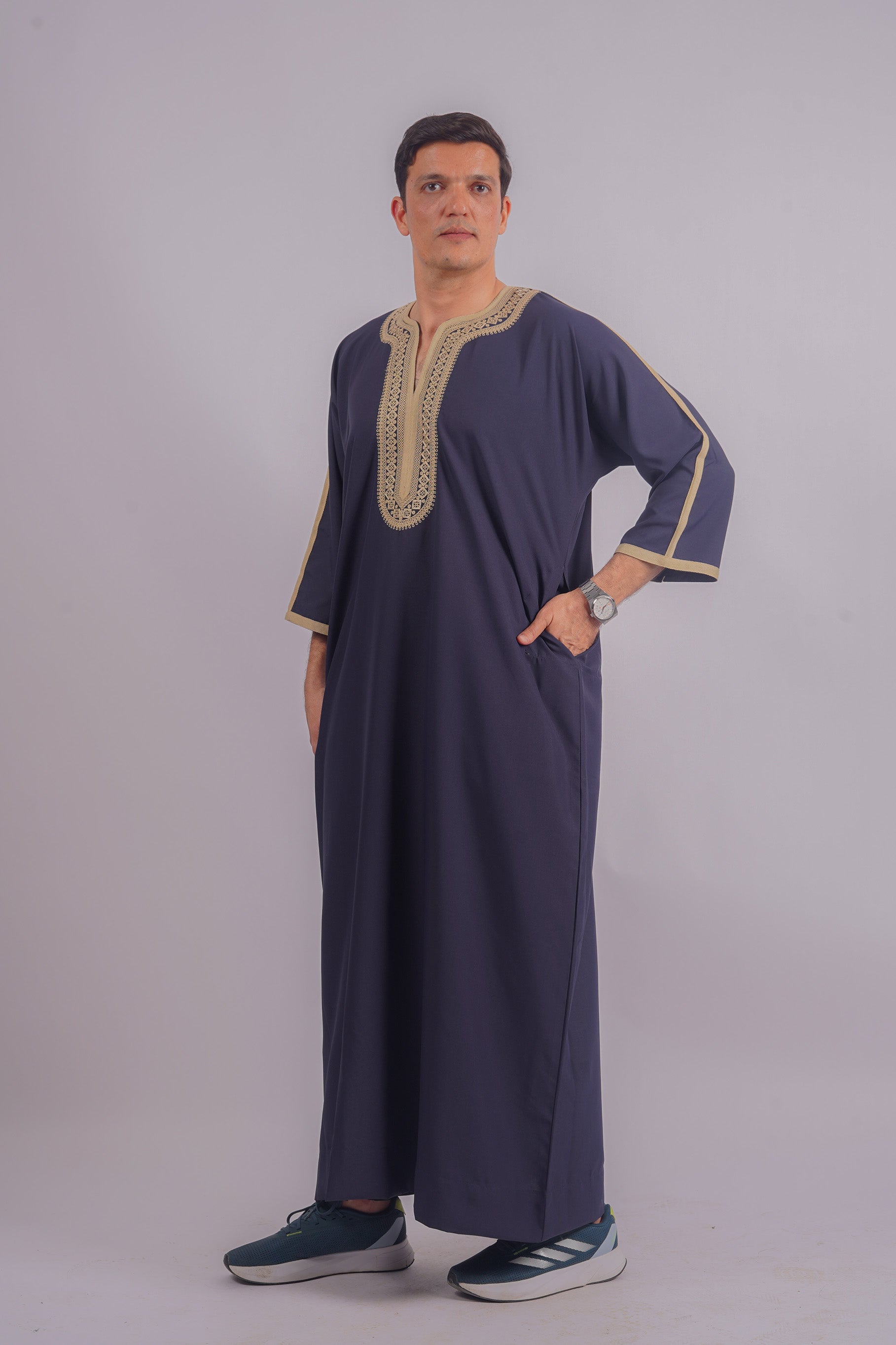 Discover the sophistication of Aamsah's Navy Blue Thobe with intricate golden detailing, a stylish alternative for festive attire.