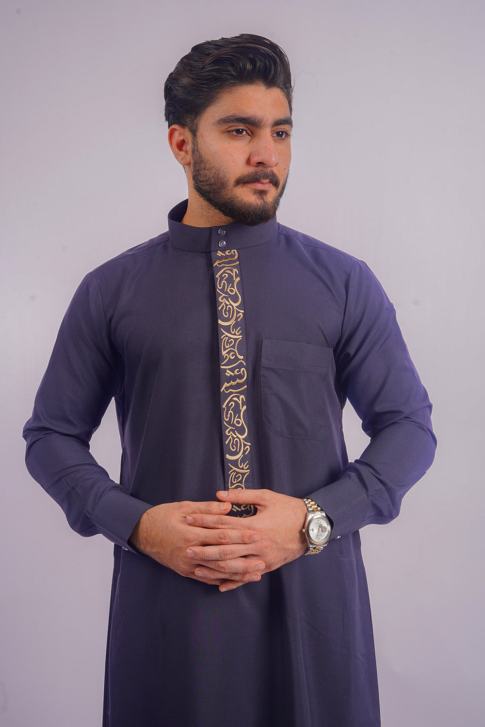 Modest yet fashionable Navy Blue Saudi Thobe from Aamsah, offering an alternative to the luxurious designs of MuslimAmerican.com and Al Aniq.