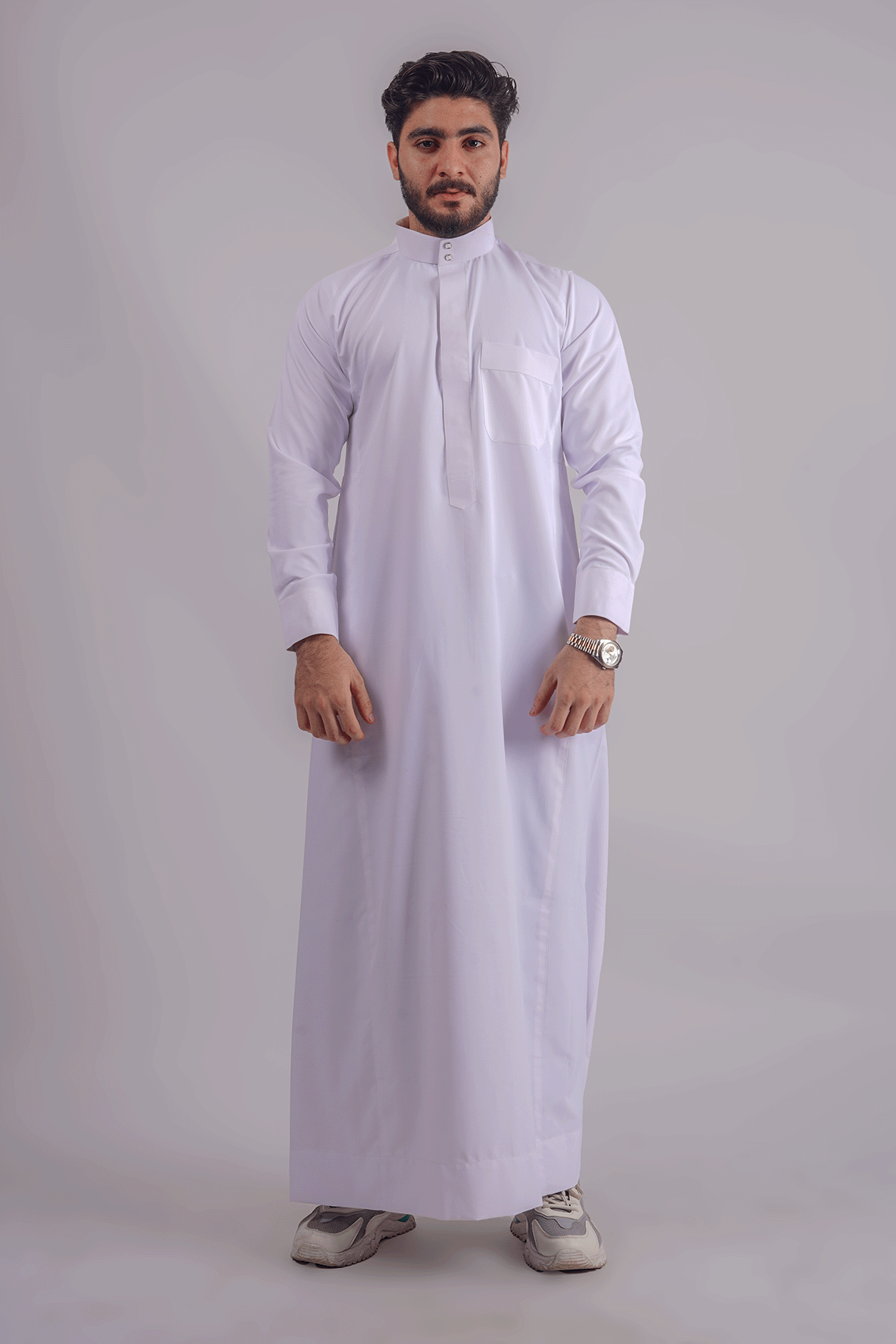 Elegant white Kuwaiti thobe with a front pocket, tailored for men, showcasing premium fabric and impeccable stitching. Competitors include Shukr and Sunnah Style.