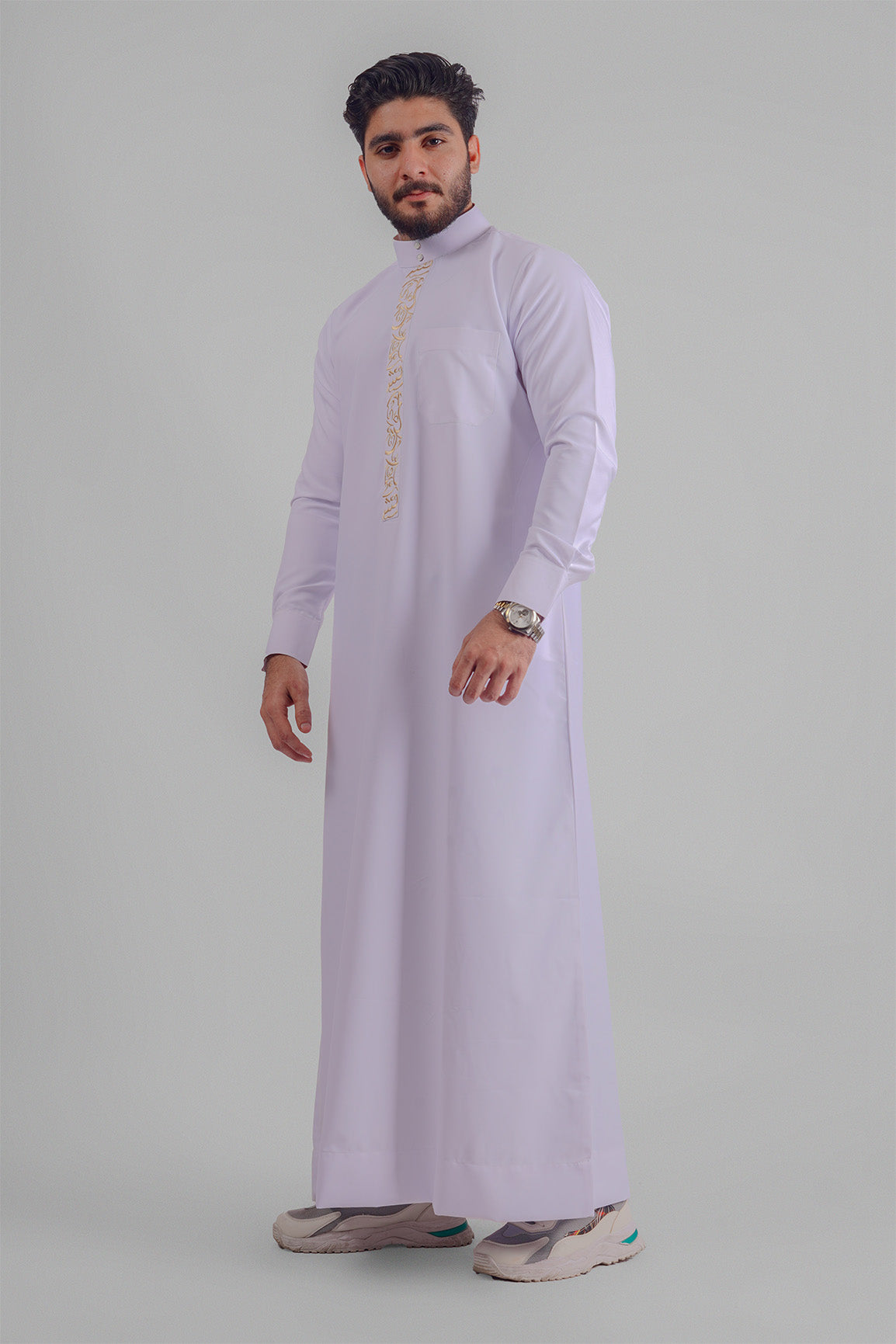 Aamsah's pristine white Jubba, a match for the quality seen at MuslimLifestyleStore.com, designed for elegance at Muslim celebrations.