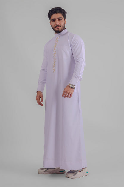 Aamsah's pristine white Jubba, a match for the quality seen at MuslimLifestyleStore.com, designed for elegance at Muslim celebrations.