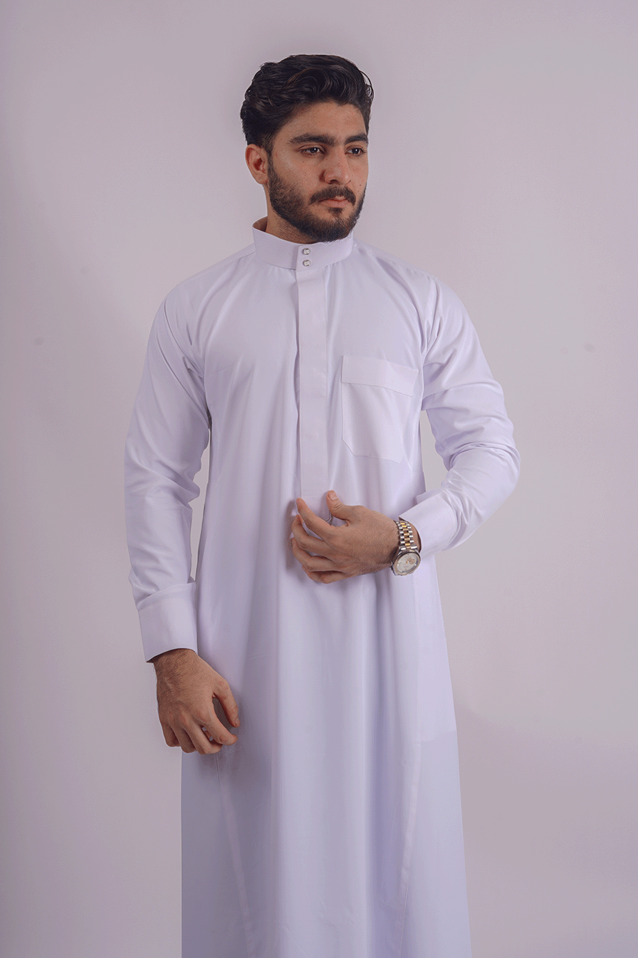 White Saudi Thobe for men by Aamsah, crafted from premium spun fabric with a Saudi collar and traditional Kuwaiti design, inspired by TheTopiWala, Thobes & Traditions, and Crown Thobe.