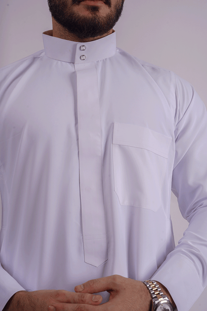 White Saudi Thobe for men by Aamsah, crafted from premium spun fabric with a Saudi collar and traditional Kuwaiti design, inspired by the collections of Muslim American Store, Crown Thobe, and Thee Thobe.