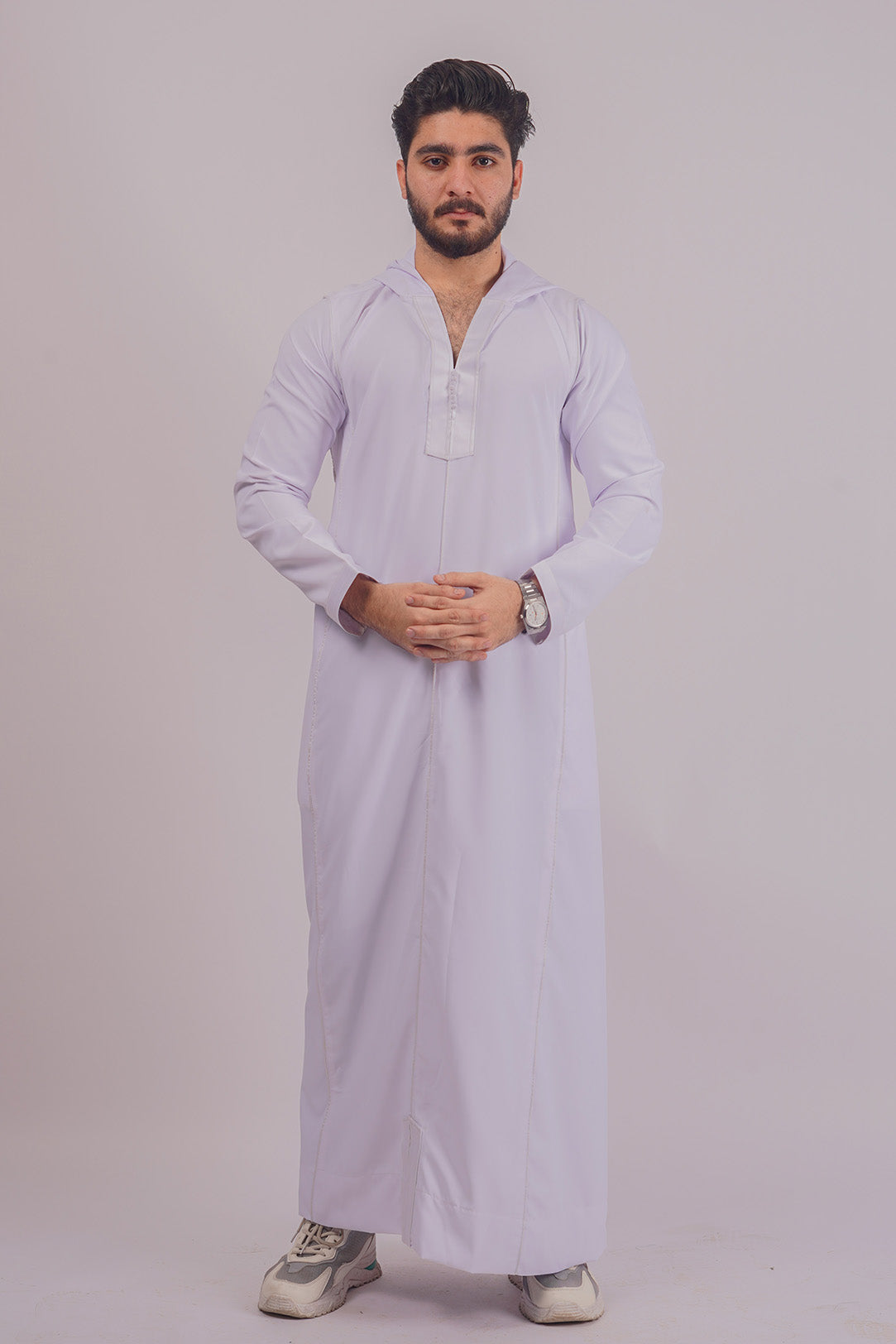 Aamsah's Hooded White Thobe, a stylish alternative to traditional attire from MuslimAmerican.com, perfect for versatile styling.