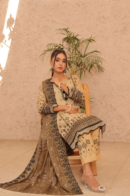 Sleek beige lawn embroidered set, perfect for festive occasions, with beautiful floral detailing and a cutwork dupatta, similar to collections from Iznik and Lakhany.