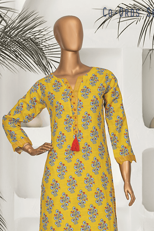 Yellow muslim modest fashion Khaddar 2-piece co-ords set for women, perfect winter wear in Pakistan with floral print kurta and matching pants by Aamsah