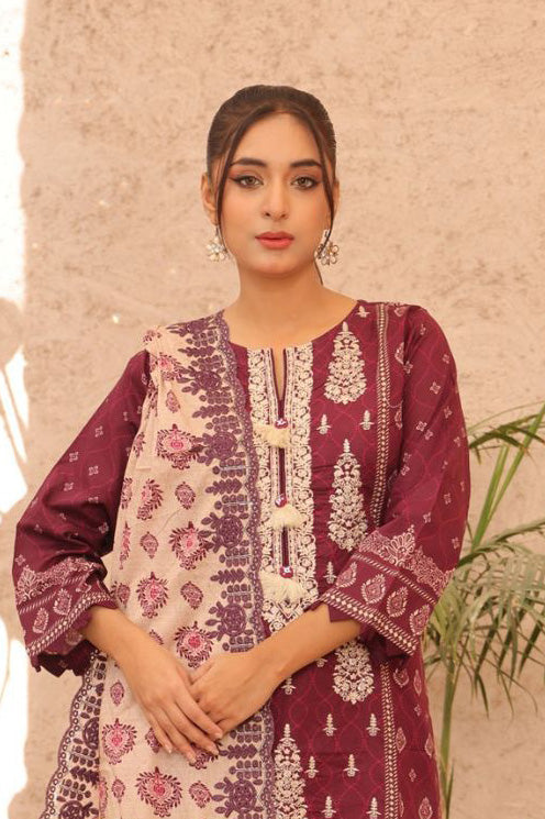 Celebrate tradition with this beautifully crafted lawn set in maroon, featuring delicate ivory embroidery. A classic look for women’s formal wear. Sanaulla Store and Iznik.